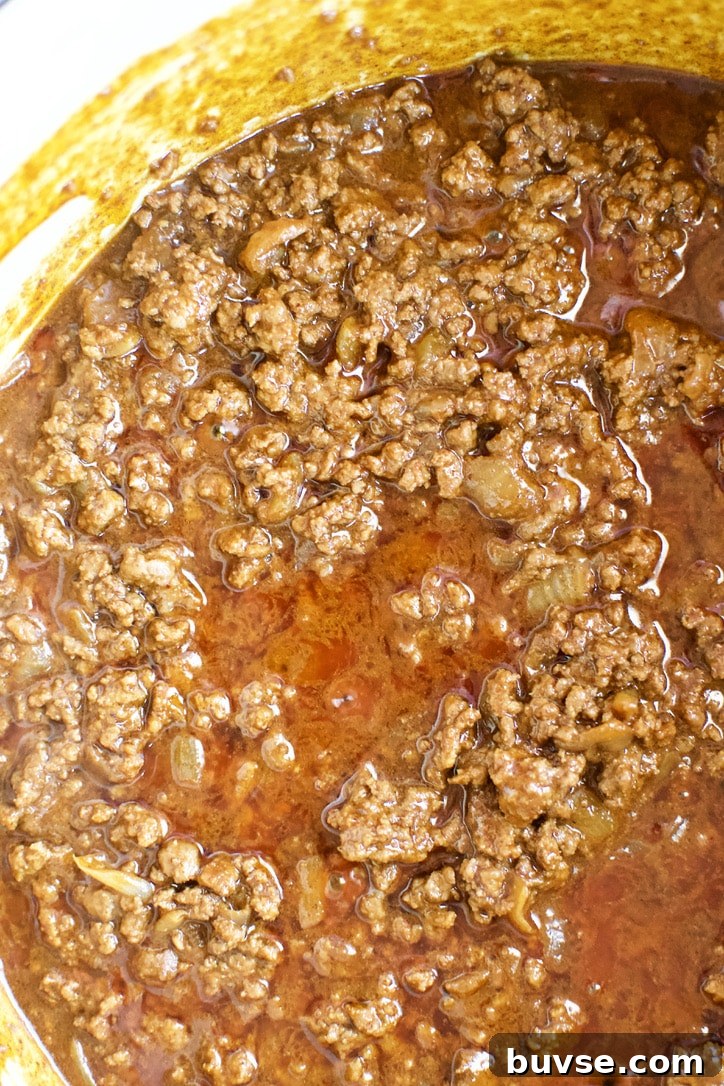 Ground beef mixture simmered in the stock.