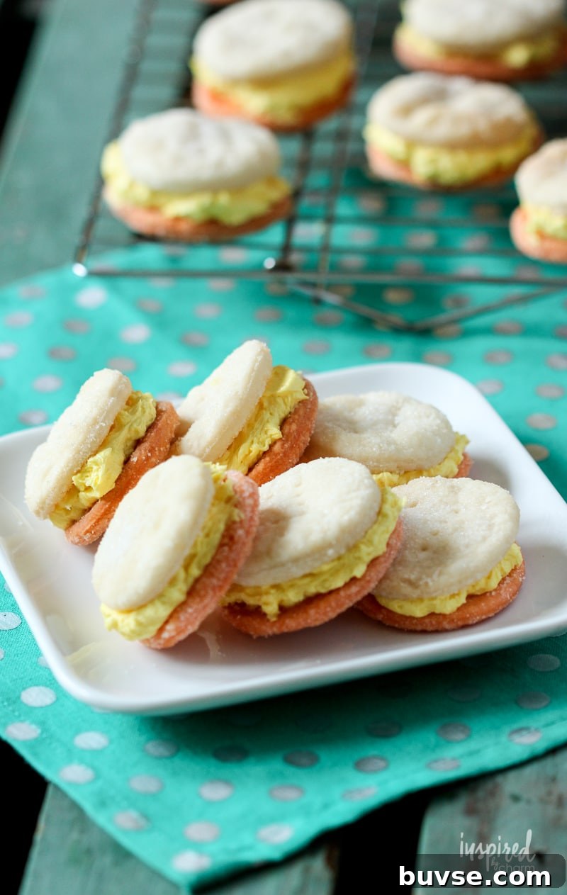 six Candy Corn Cream Wafer Cookies stacked on a plate.