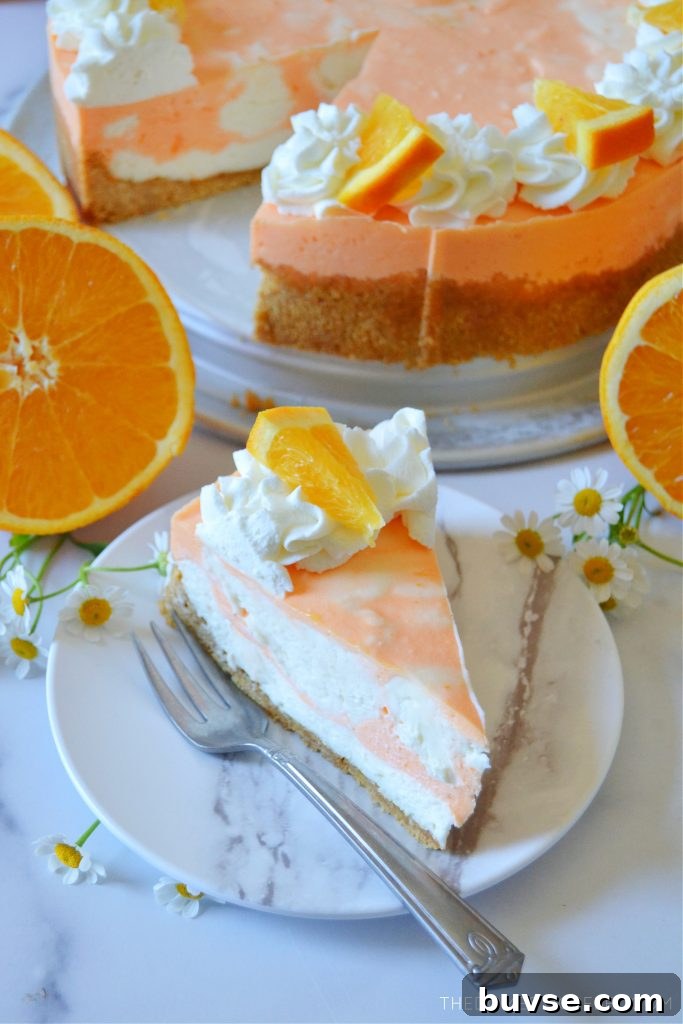 orange creamsicle cheesecake and a slice with oranges and flowers