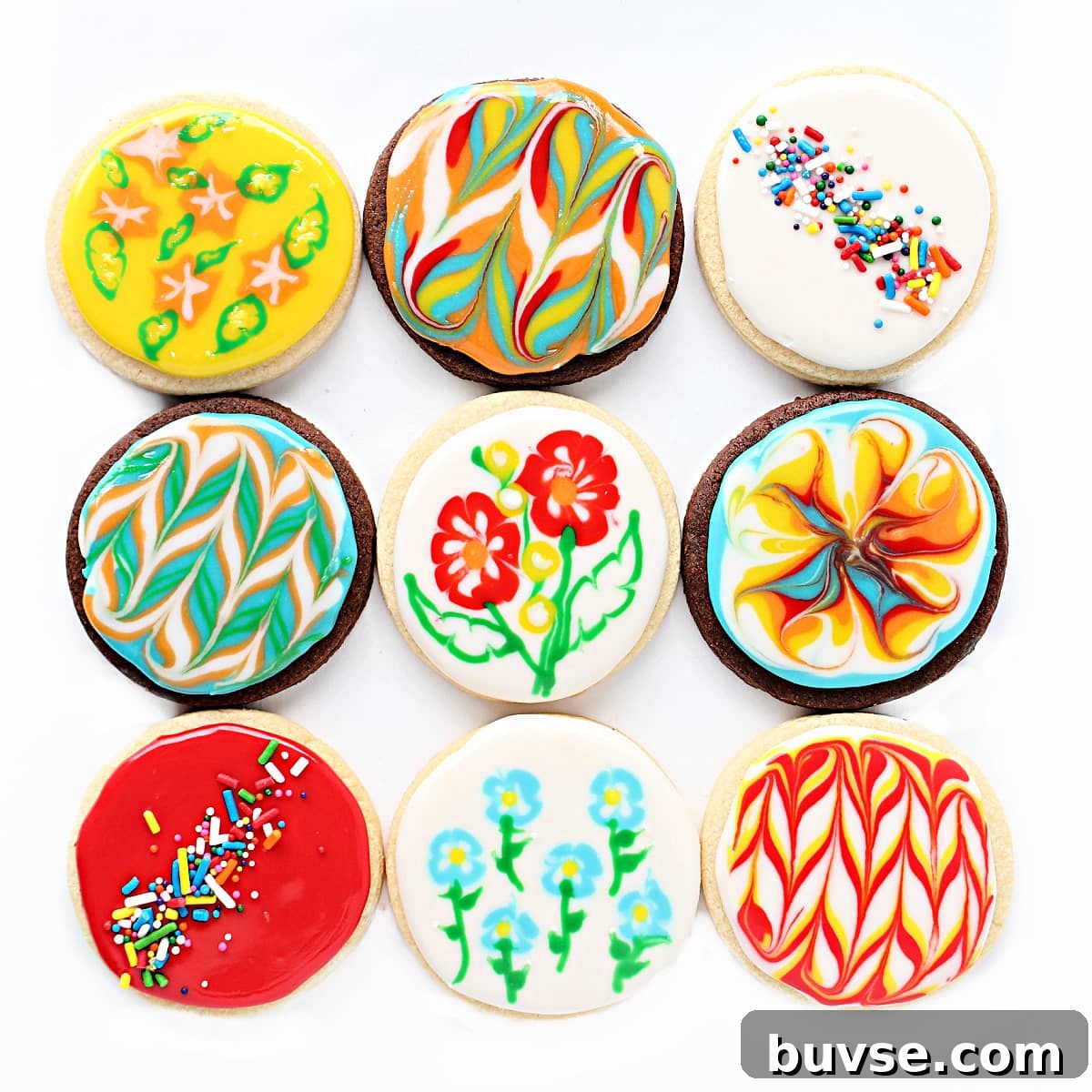 Glaze Icing Recipe for Cakes, Donuts, and Pastries 5 Chocolate and vanilla sugar cookie circles decorated with glaze icing designs or sprinkles.