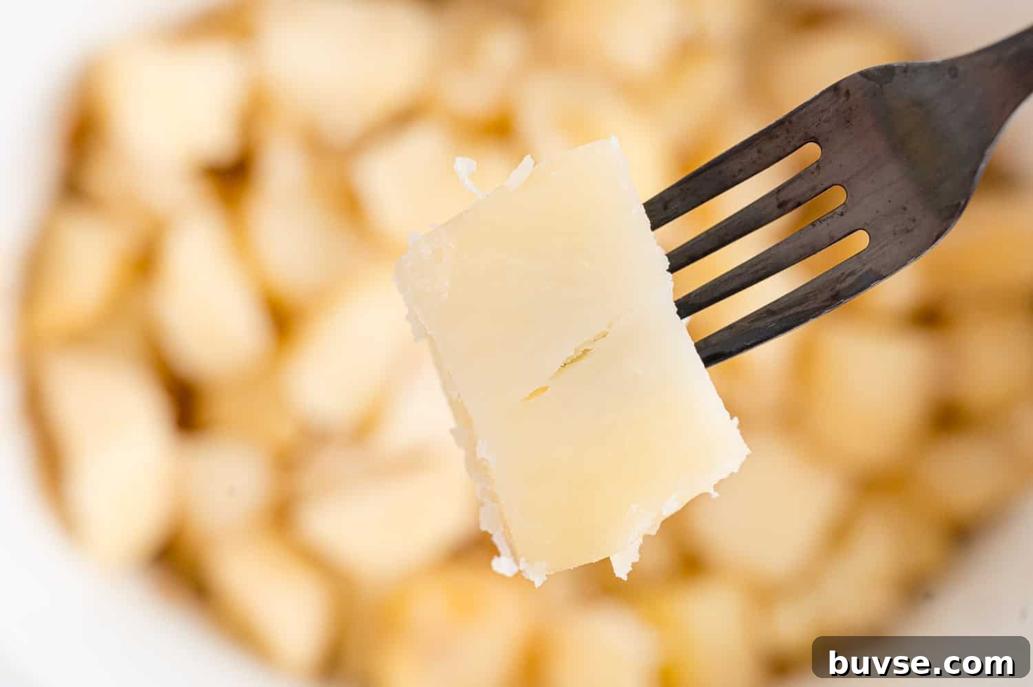 Fork in a cooked potato.