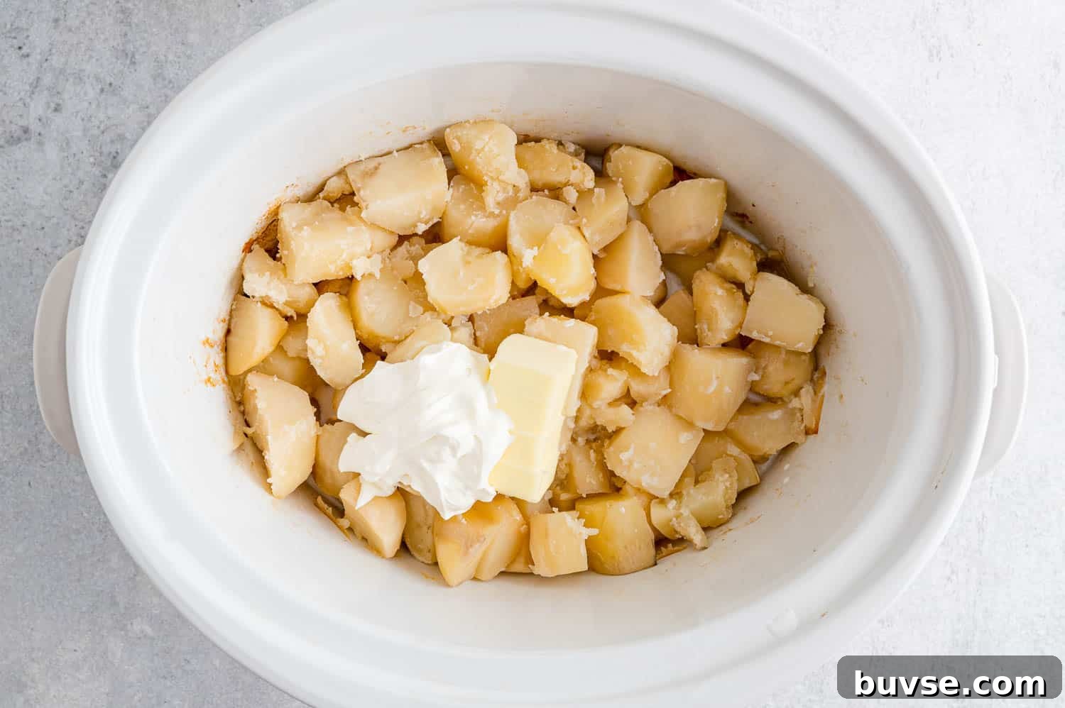 Sour cream and butter added to slow cooker.