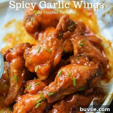 spicy garlic wings garnishe with chives