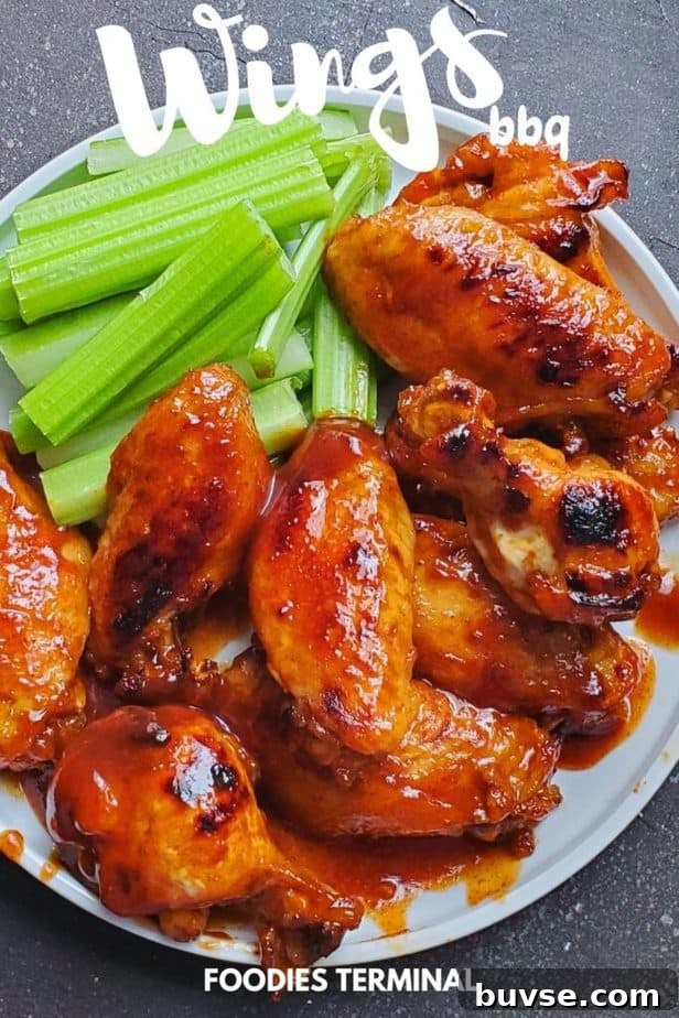 instant pot bbq chicken wings served with celery sticks on a white plate