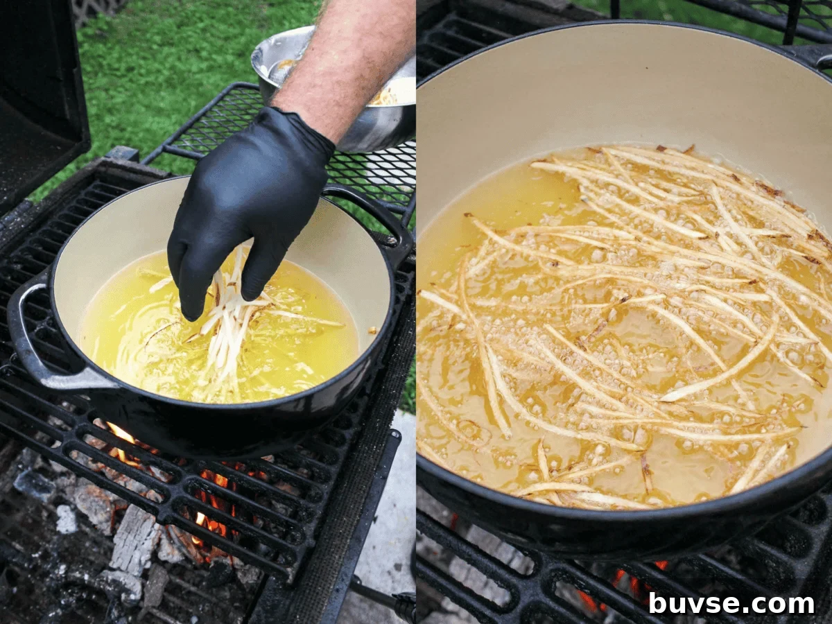 Frying the raw potatoes in the beef tallow.