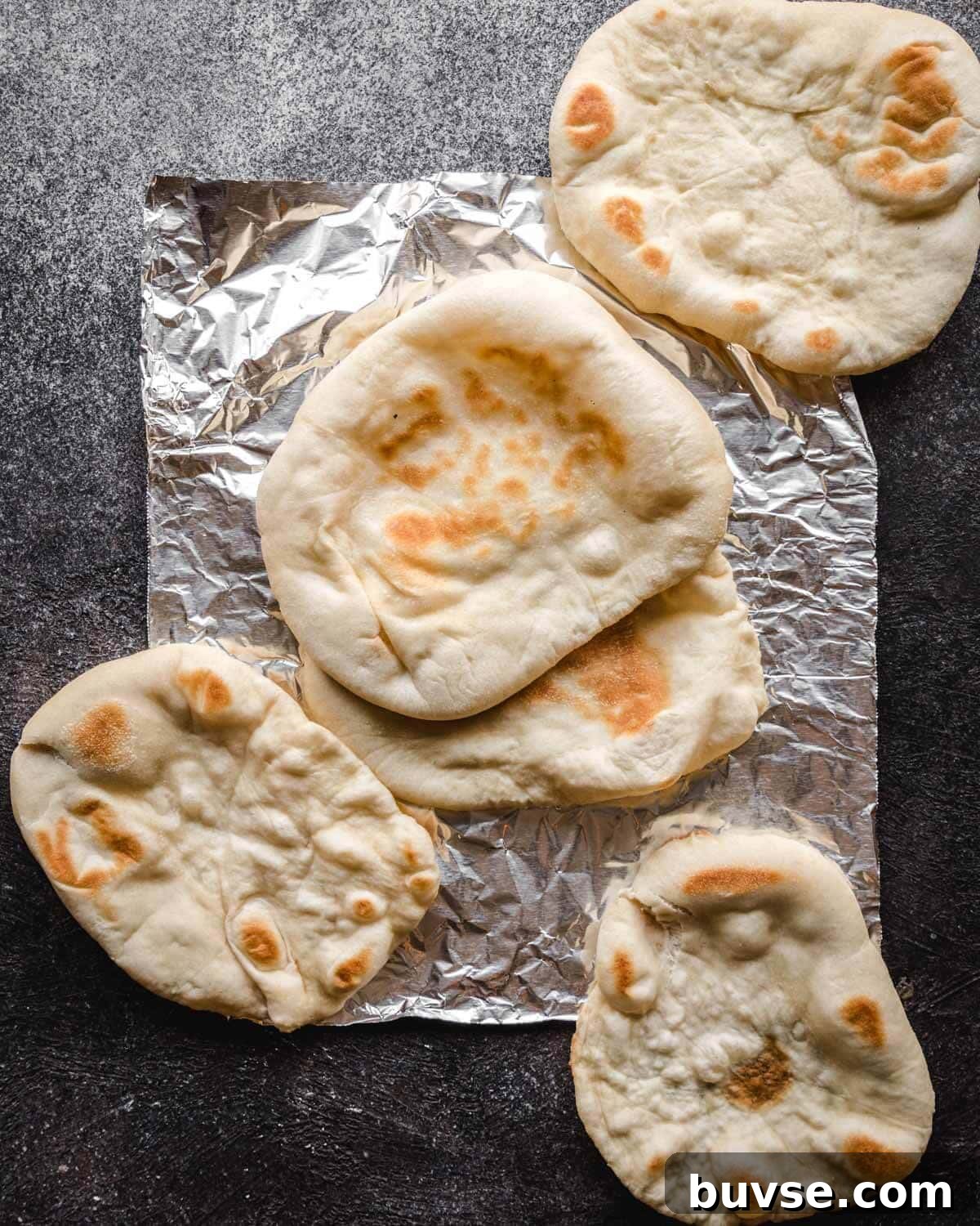Homemade Garlic Pita Bread Recipe 9 Cooking pita on skillet