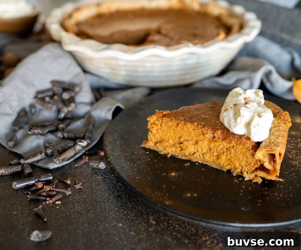 slice of smoked pumpkin pie by whole pie