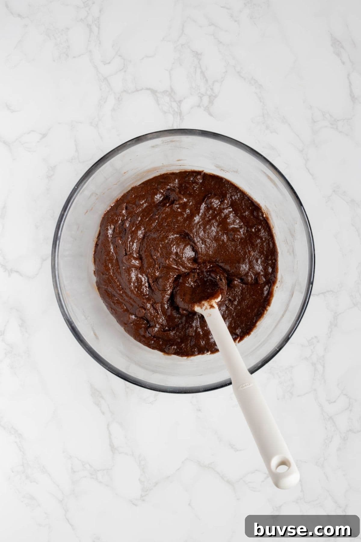 Fudgy Chocolate Sourdough Brownie Bites 5 Chocolate brownie batter mixed in a bowl for sourdough chocolate brownie bites.