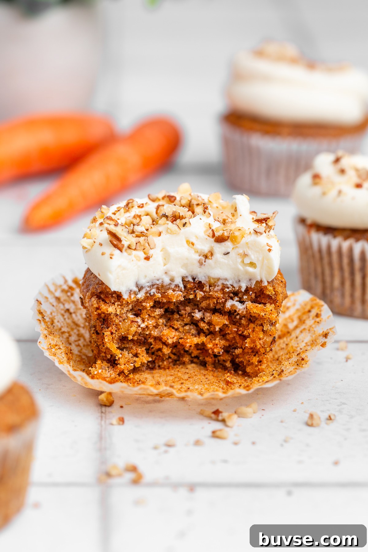 Stack of frosted carrot cupcakes