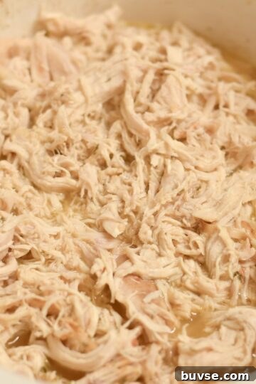 Tender slow cooker shredded chicken made with chicken breasts and simple seasonings.