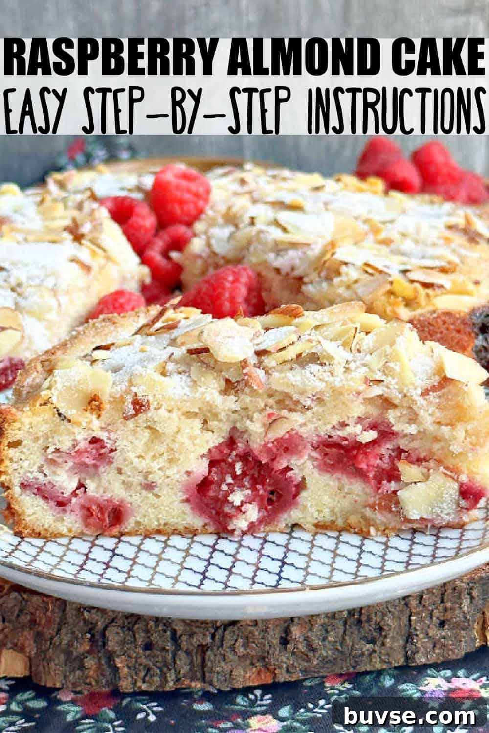 Raspberry Almond Cake is mixed in one bowl and baked in a springform pan, packed with raspberries and topped with flaked almonds and sugar.