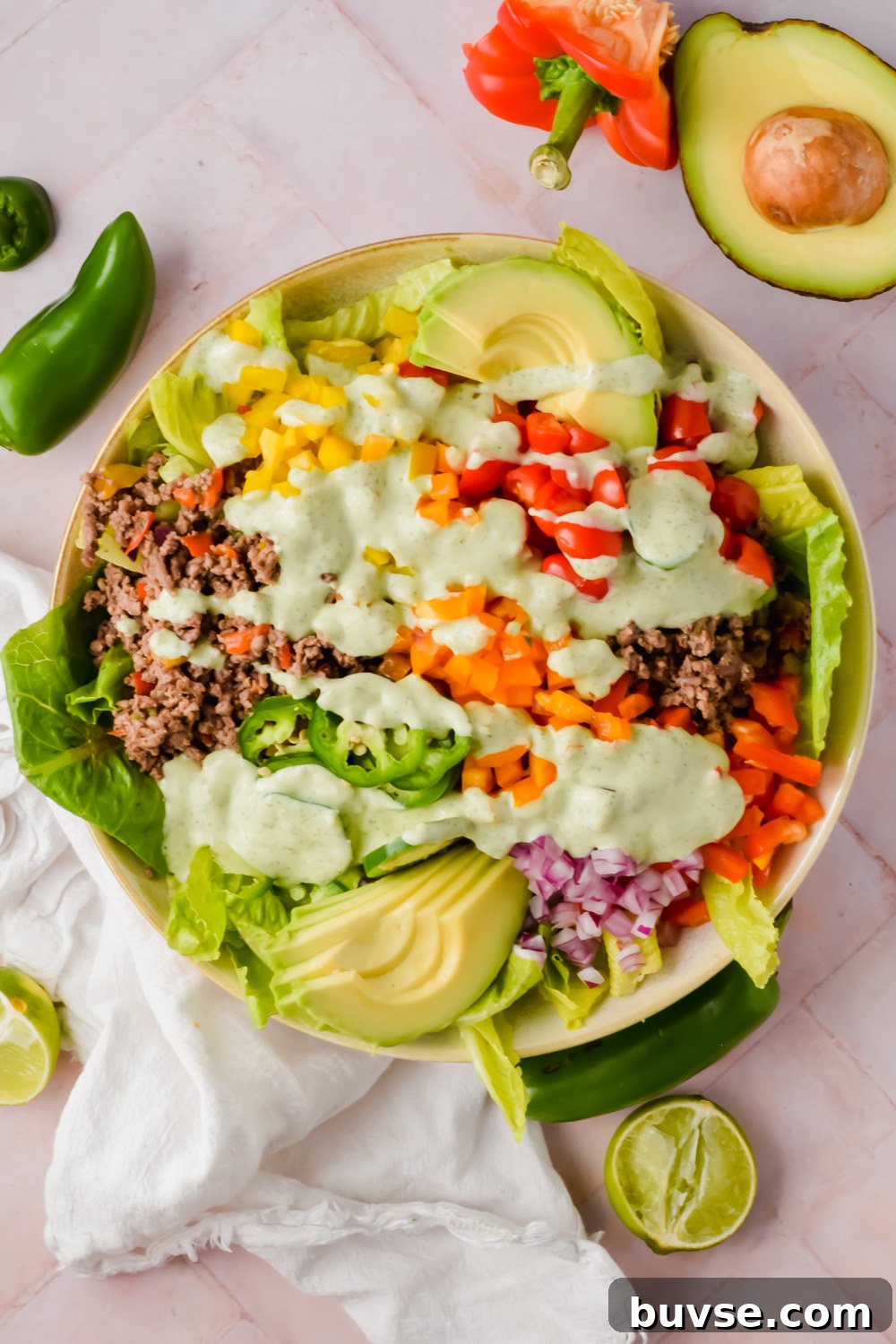Homemade Creamy Jalapeno Sauce for Tacos and Dips 7 big bowl of ranch taco salad dressed with creamy jalapeño sauce before tossing.