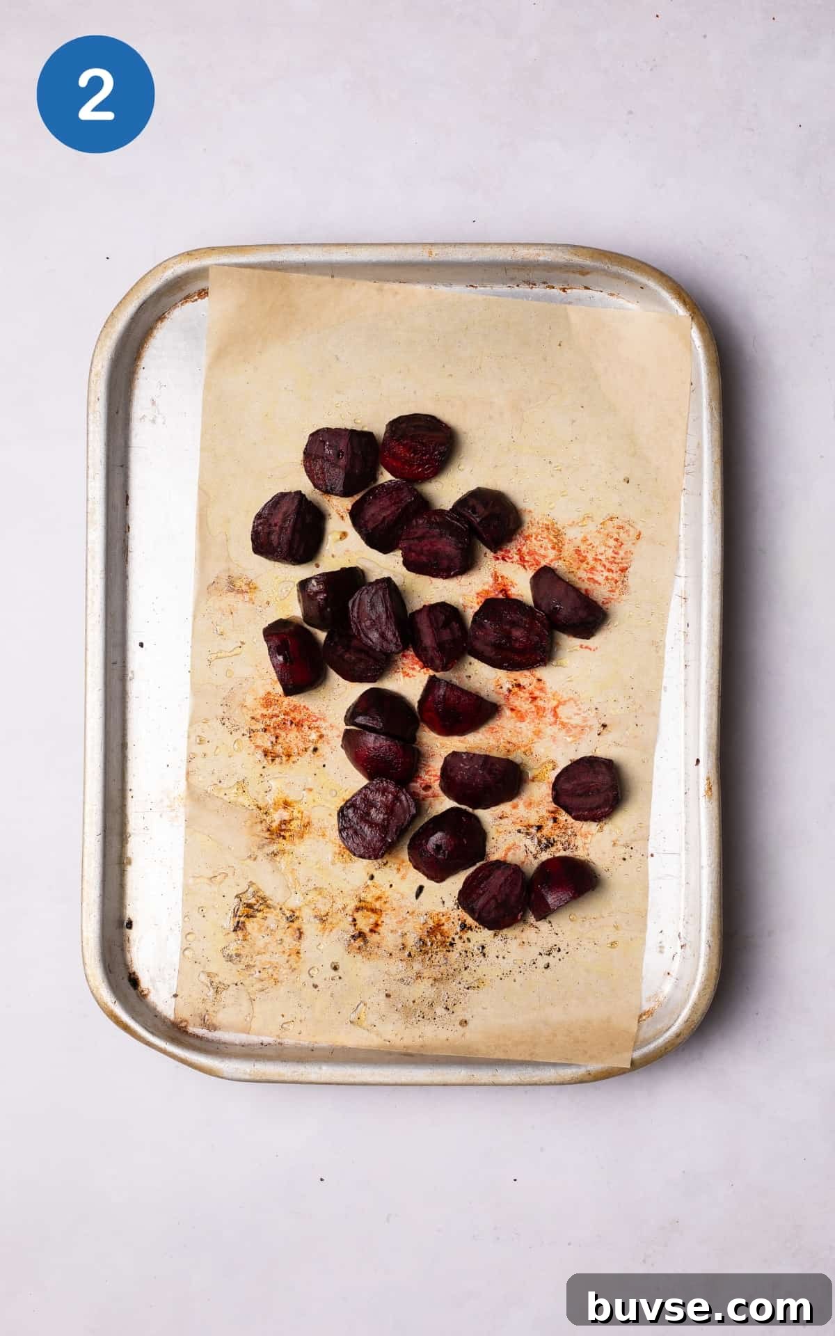 beetroot cubes on a lined baking tray.