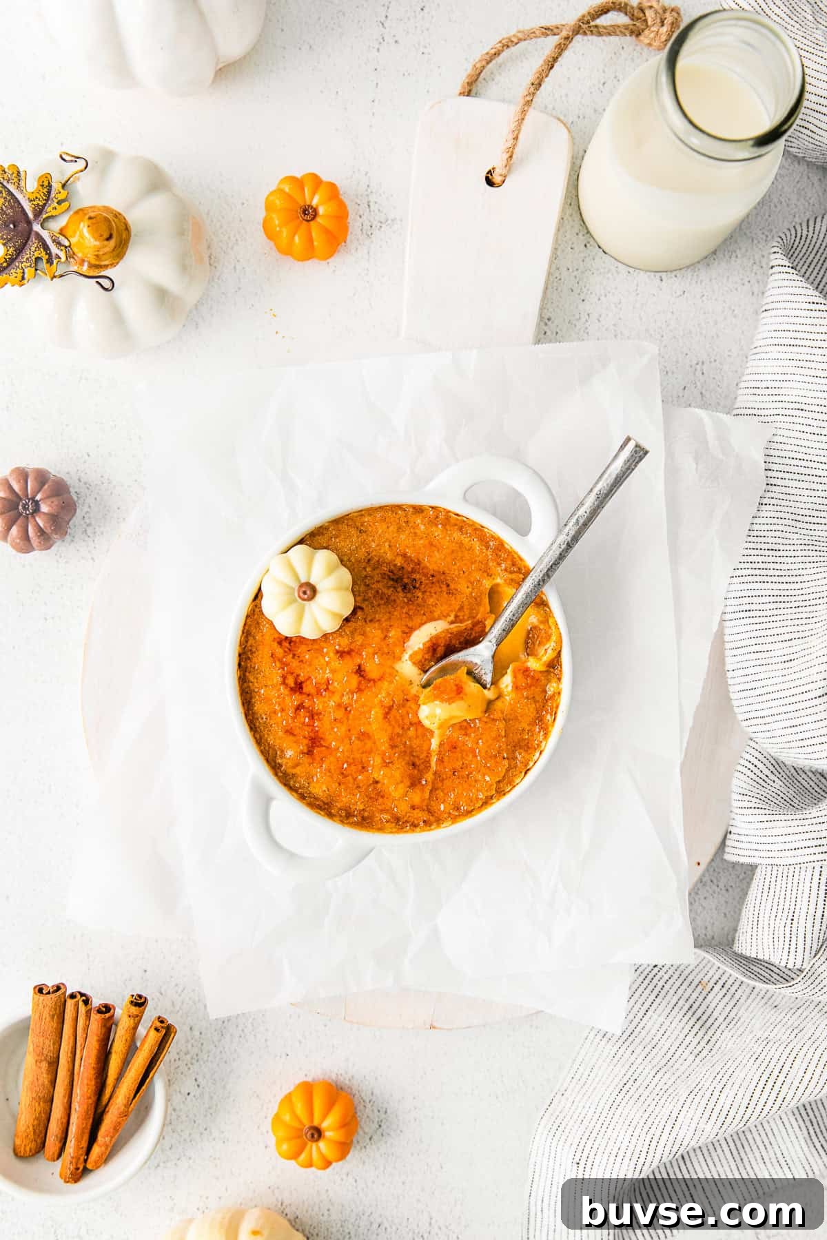 Silky Pumpkin Crème Brûlée Recipe 10 Pumpkin Creme Brulee with a spoon into the custard.