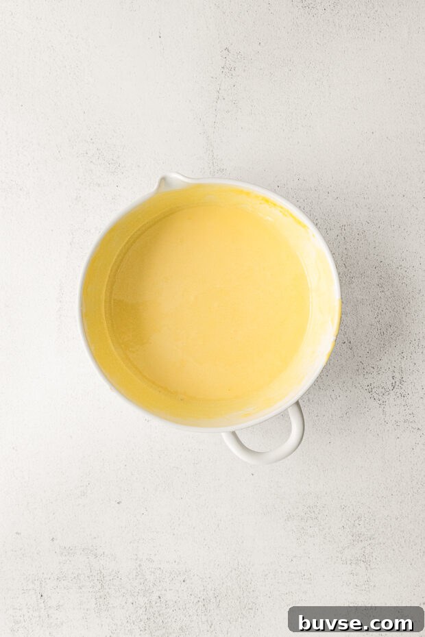 Silky Pumpkin Crème Brûlée Recipe 6 Warm milk and eggs in a bowl.