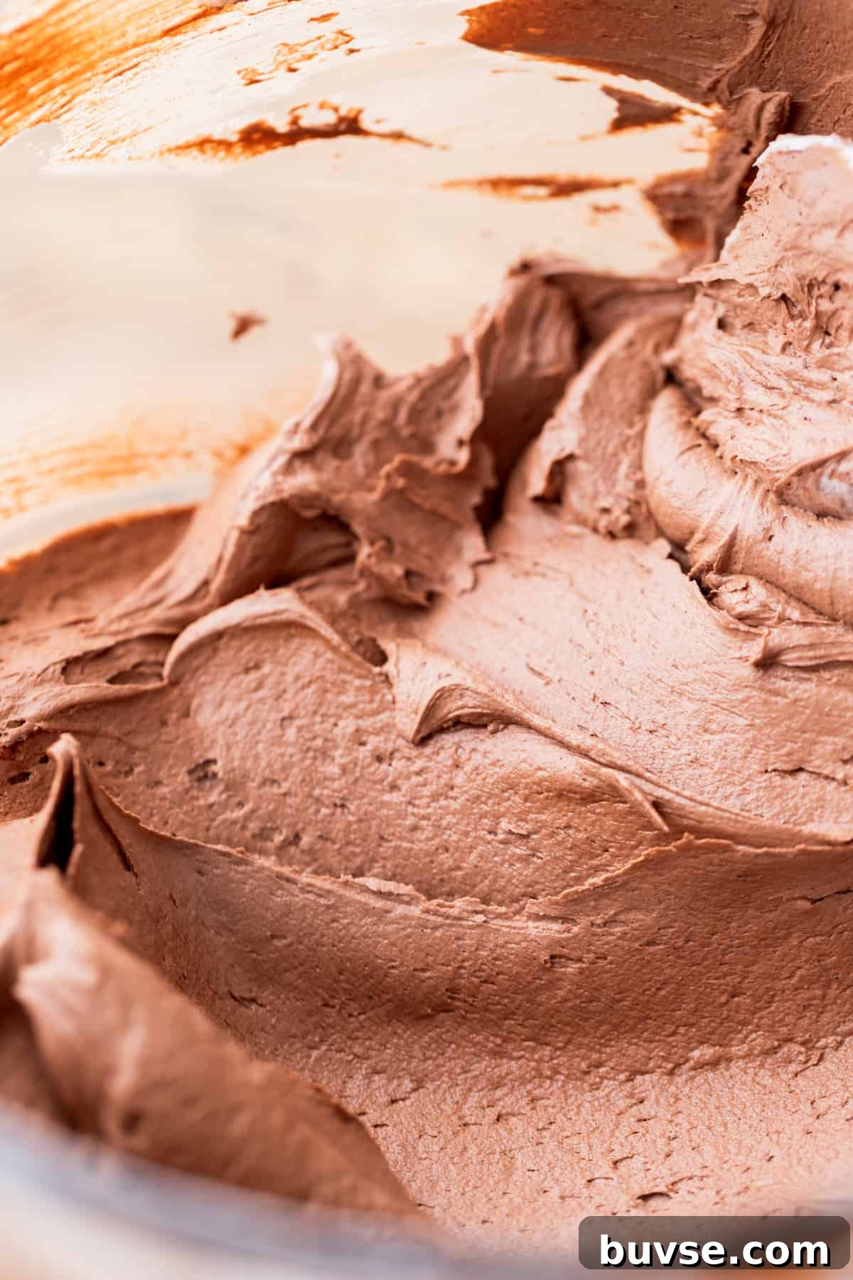 Hot chocolate frosting in a glass bowl.