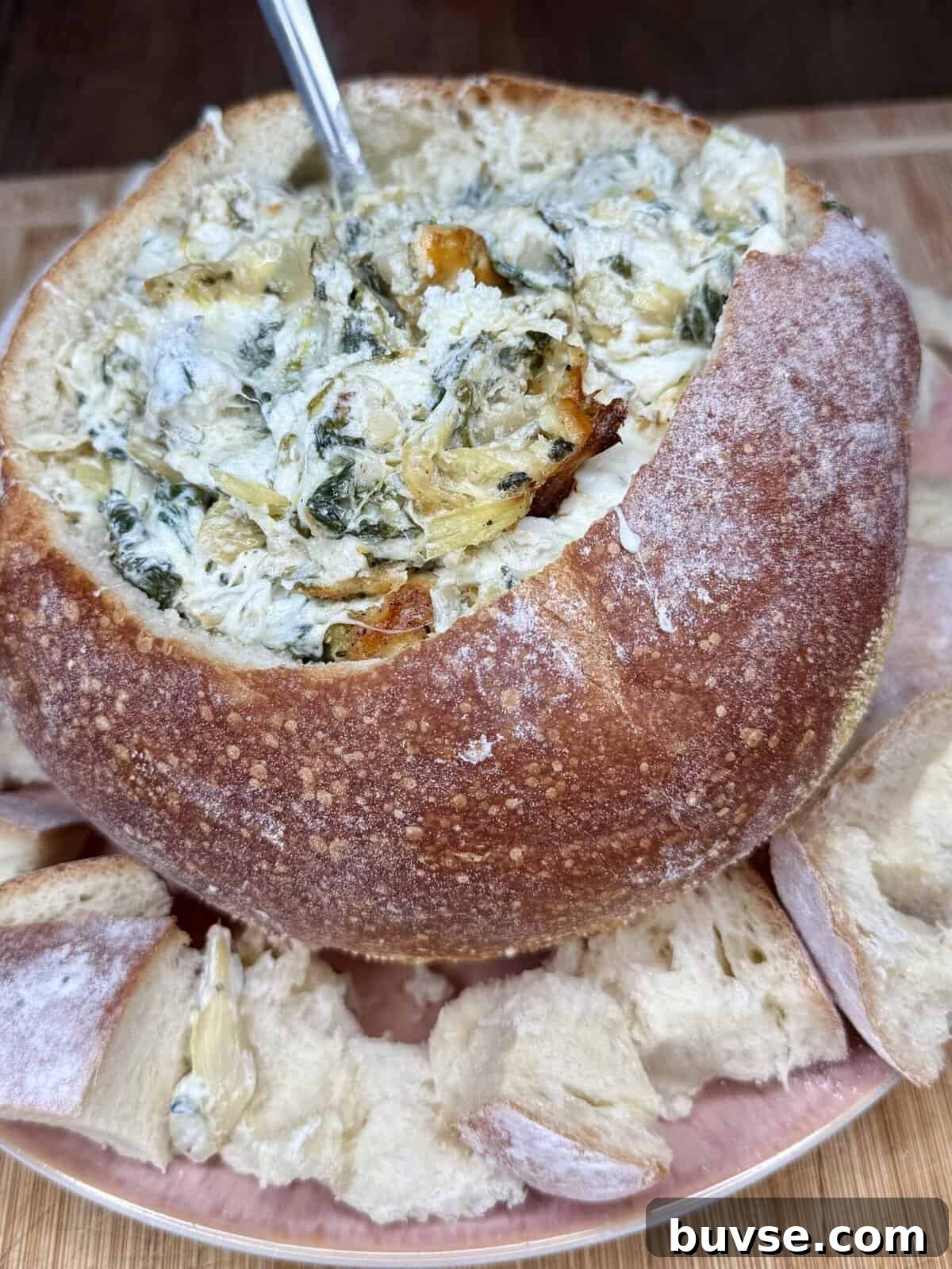 Baked spinach and artichoke dip in a serving dish