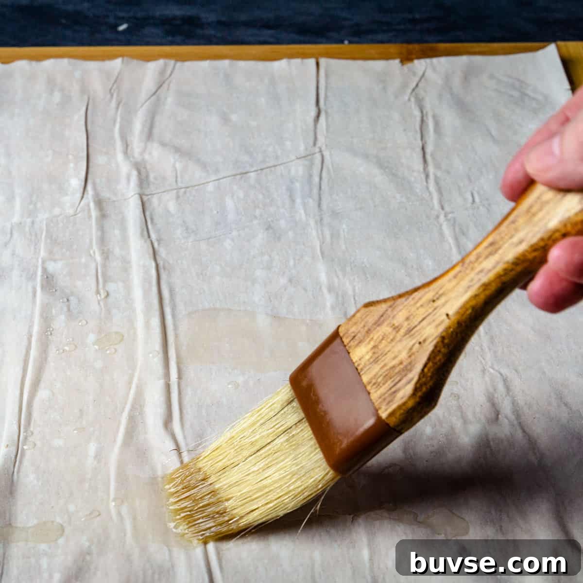 Phyllo Dough Recipes and Techniques 6 Oiling the filo sheet with pastry brush.