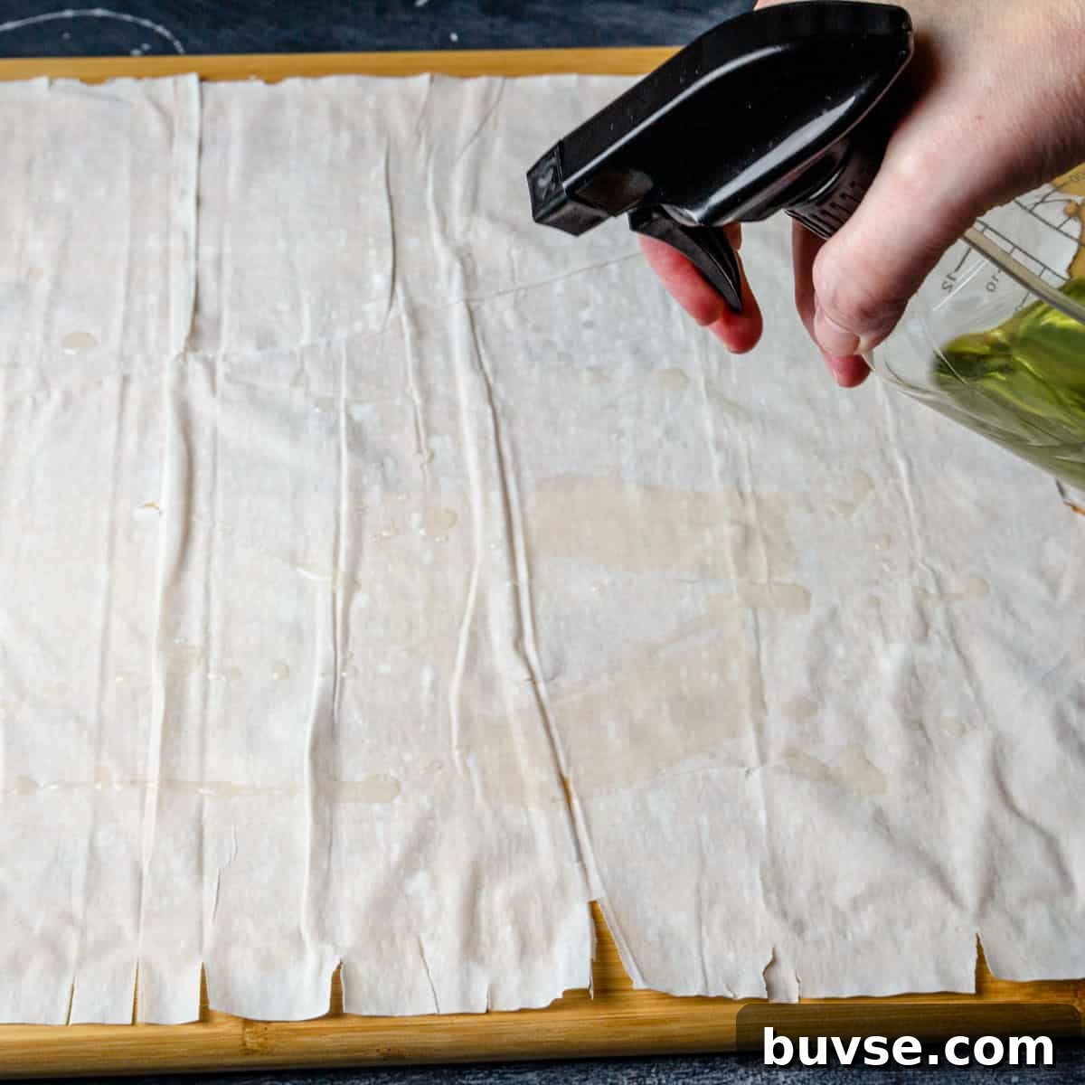 Phyllo Dough Recipes and Techniques 7 Oiling the filo with oil in a spray bottle.