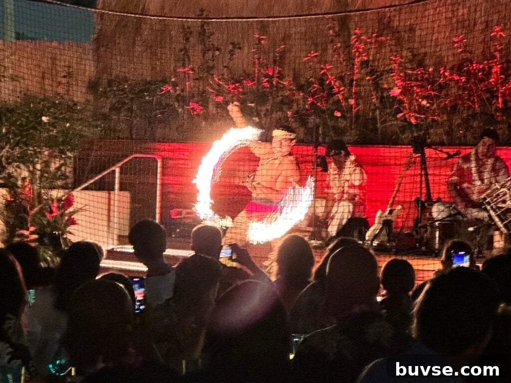 A fire dancer performing on stage at the Pāʻina Lūʻau Waikīkī at the Waikiki Beach Marriott.