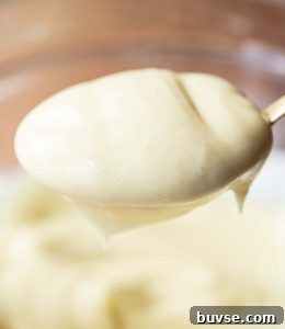 closeup shots of mayo on golden spoon