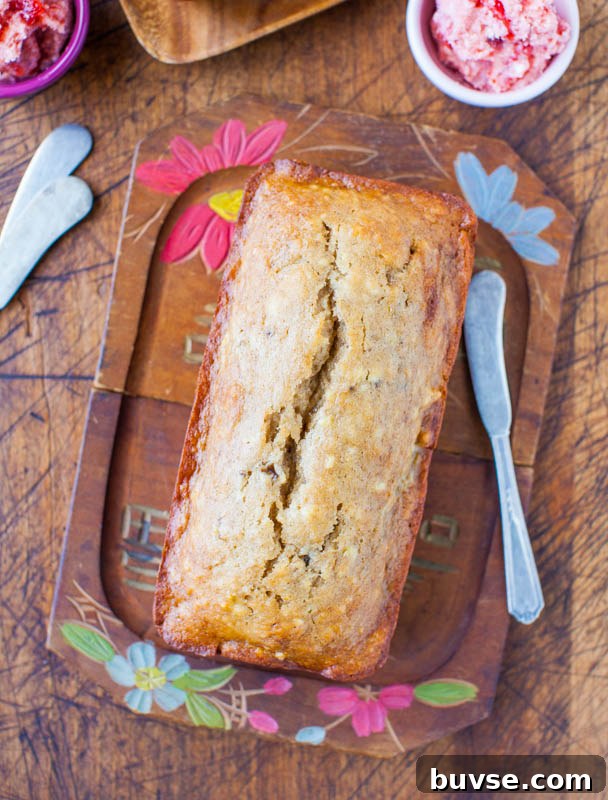 loaf of Buttermilk Banana Bread on wood tray