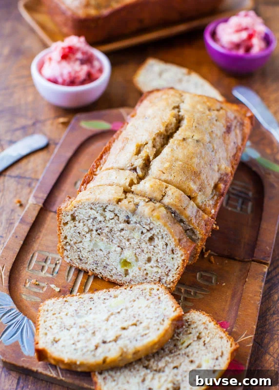 slice loaf of banana bread with buttermilk on wood tray