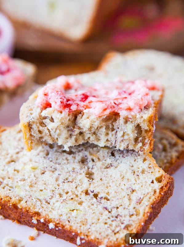 slice of Buttermilk Banana Bread topped with strawberry butter