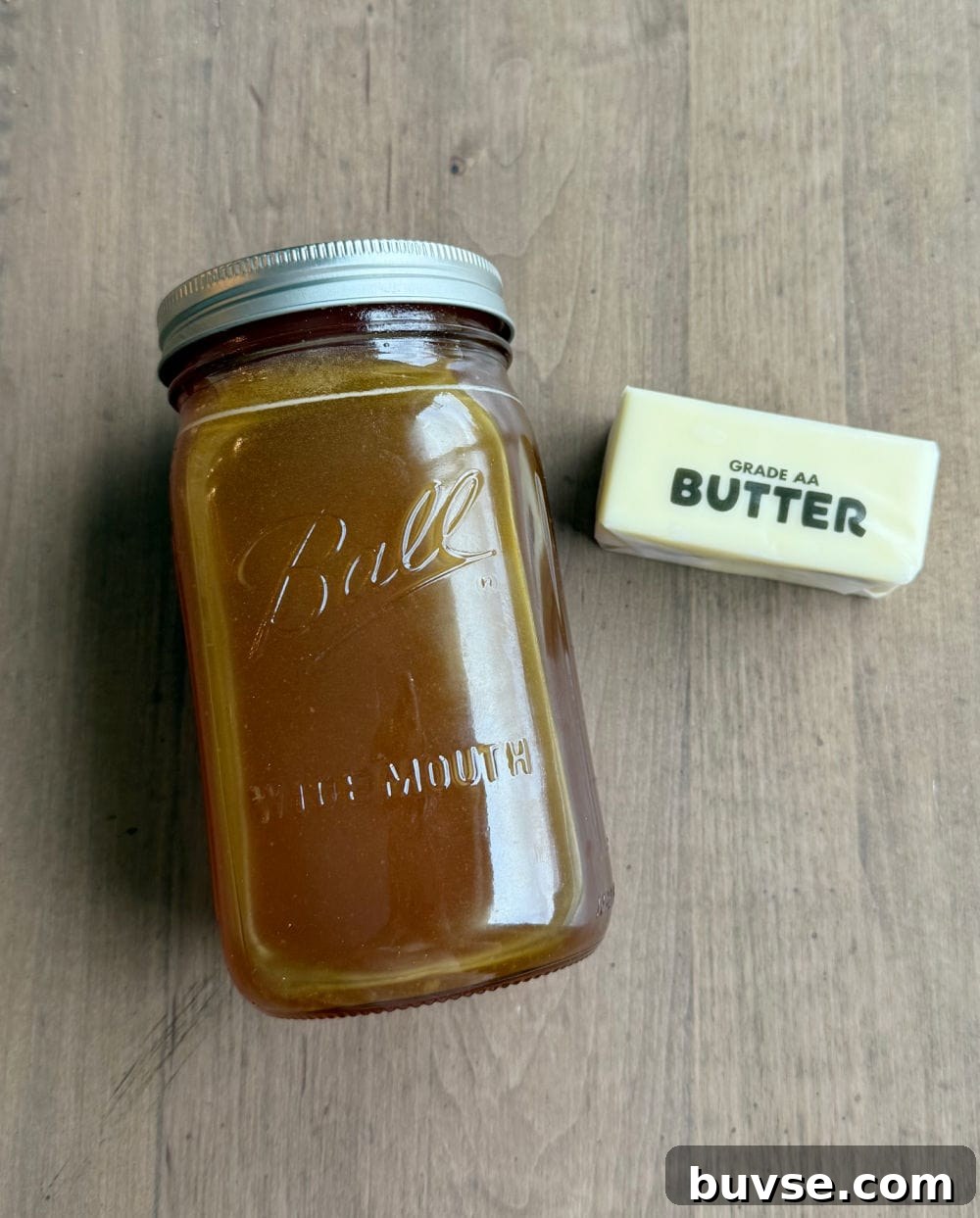 stick of butter and jar of raw honey.