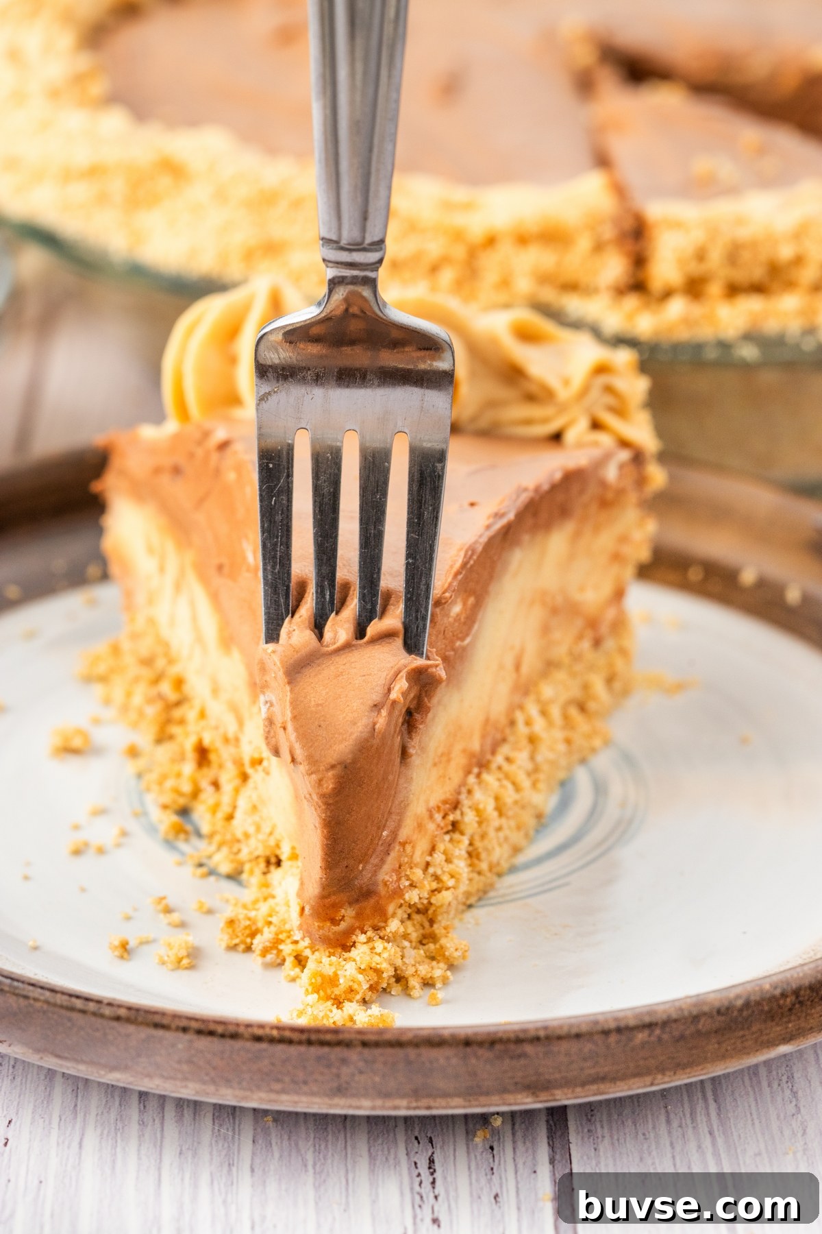 taking a bite of peanut butter cream pie