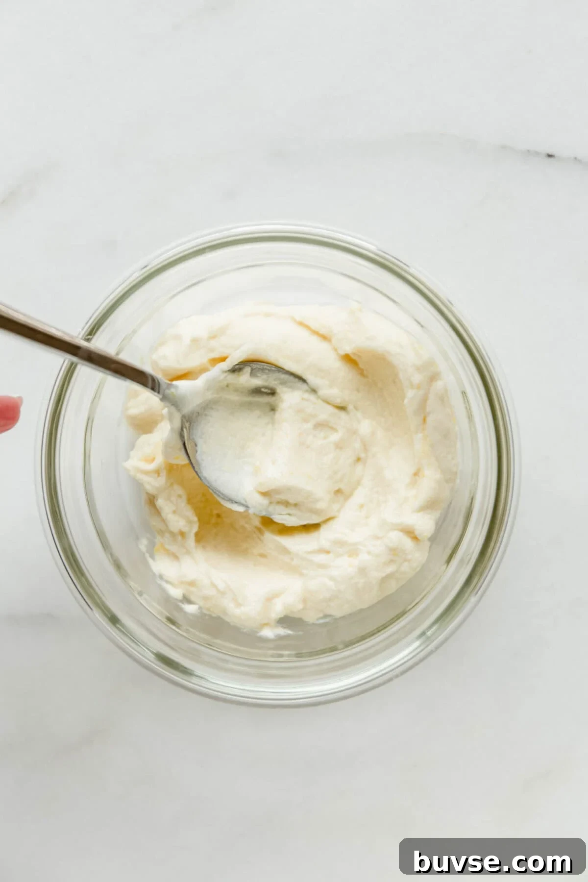 vanilla greek yogurt pudding in a clear container.