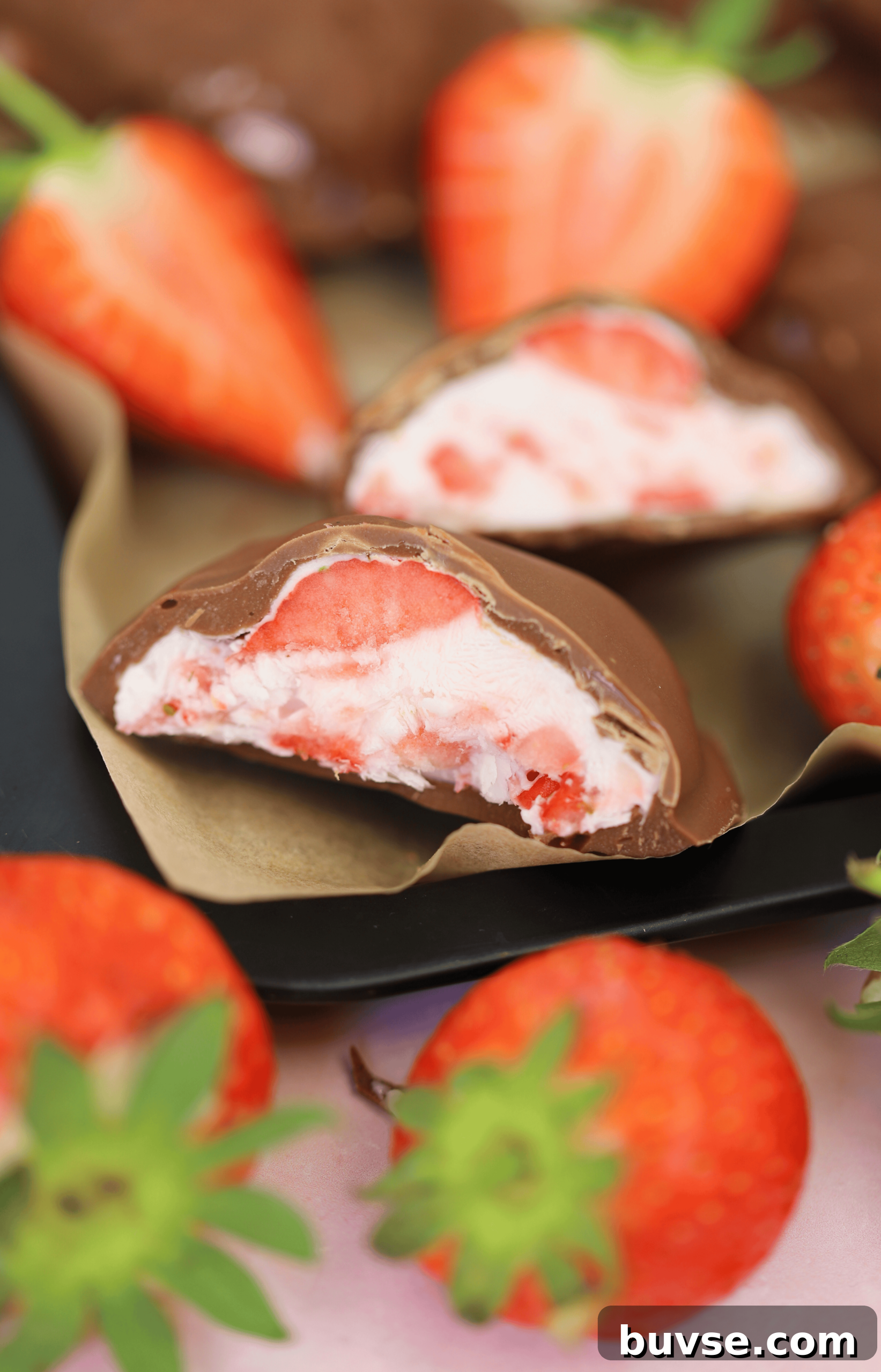 Frozen strawberry yoghurt bites covered in chocolate.