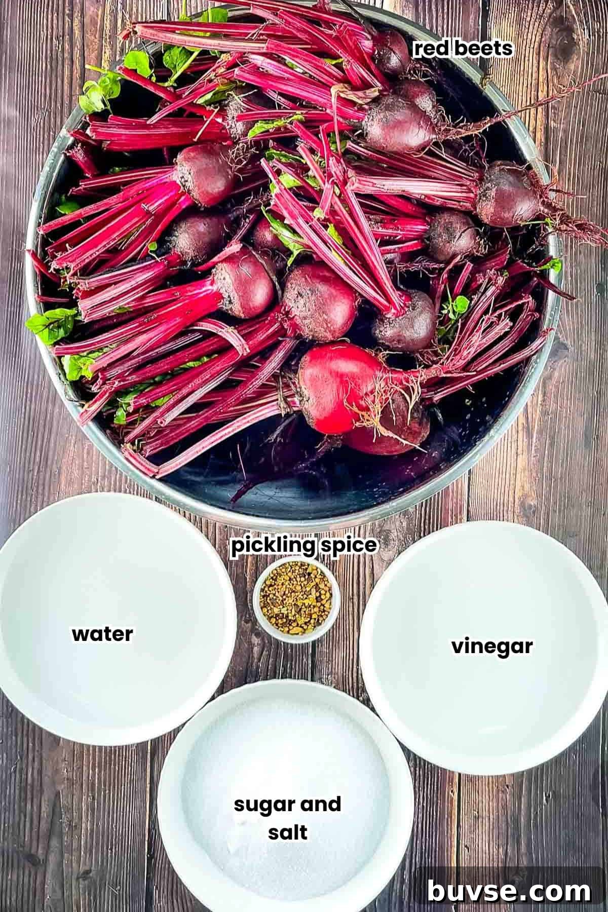 Homemade Old-Fashioned Pickled Beets Recipe 3 The ingredients for pickled beets measured out and placed on a wooden table.