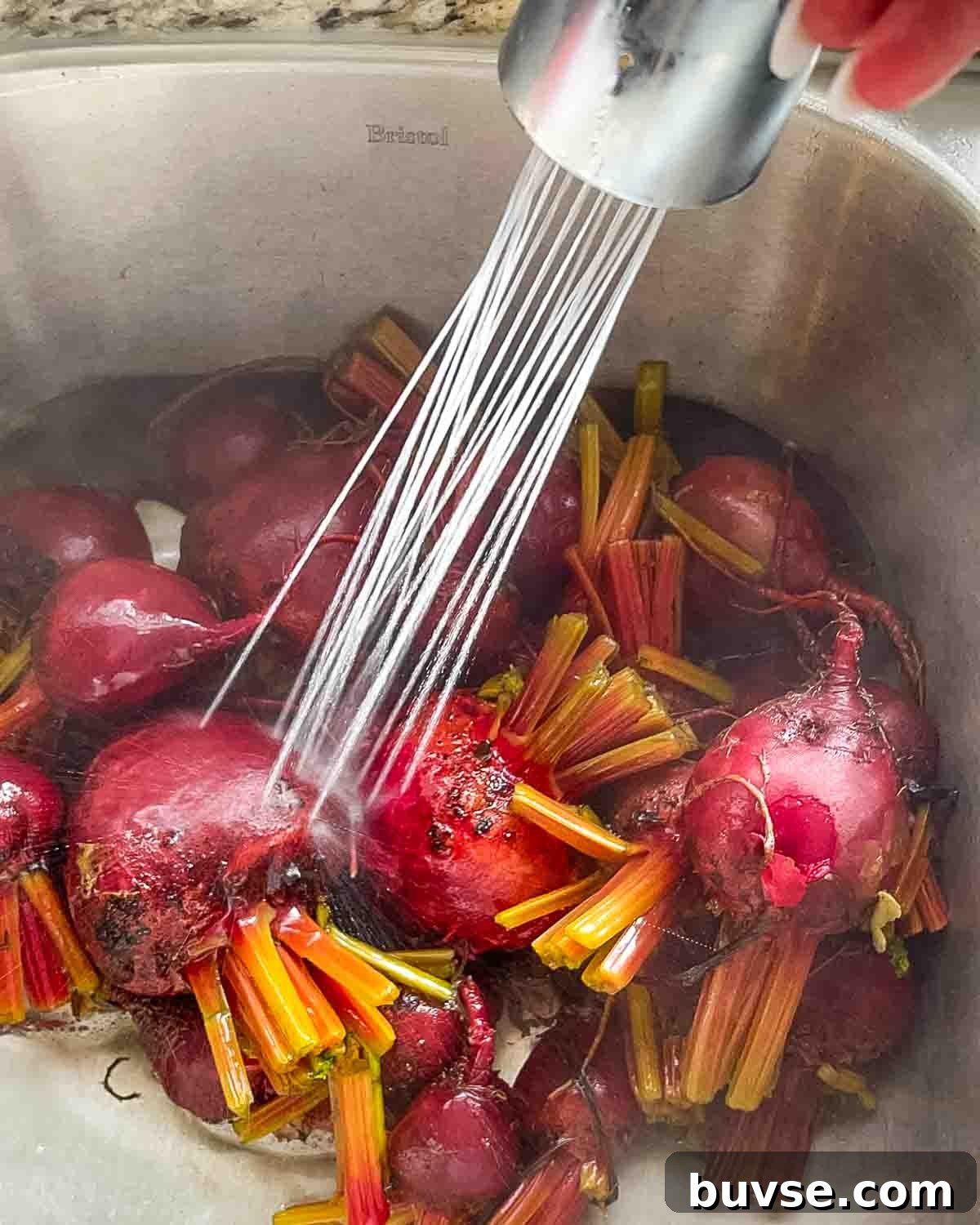 Homemade Old-Fashioned Pickled Beets Recipe 9 The beets being cooled down with cold water from the tap.