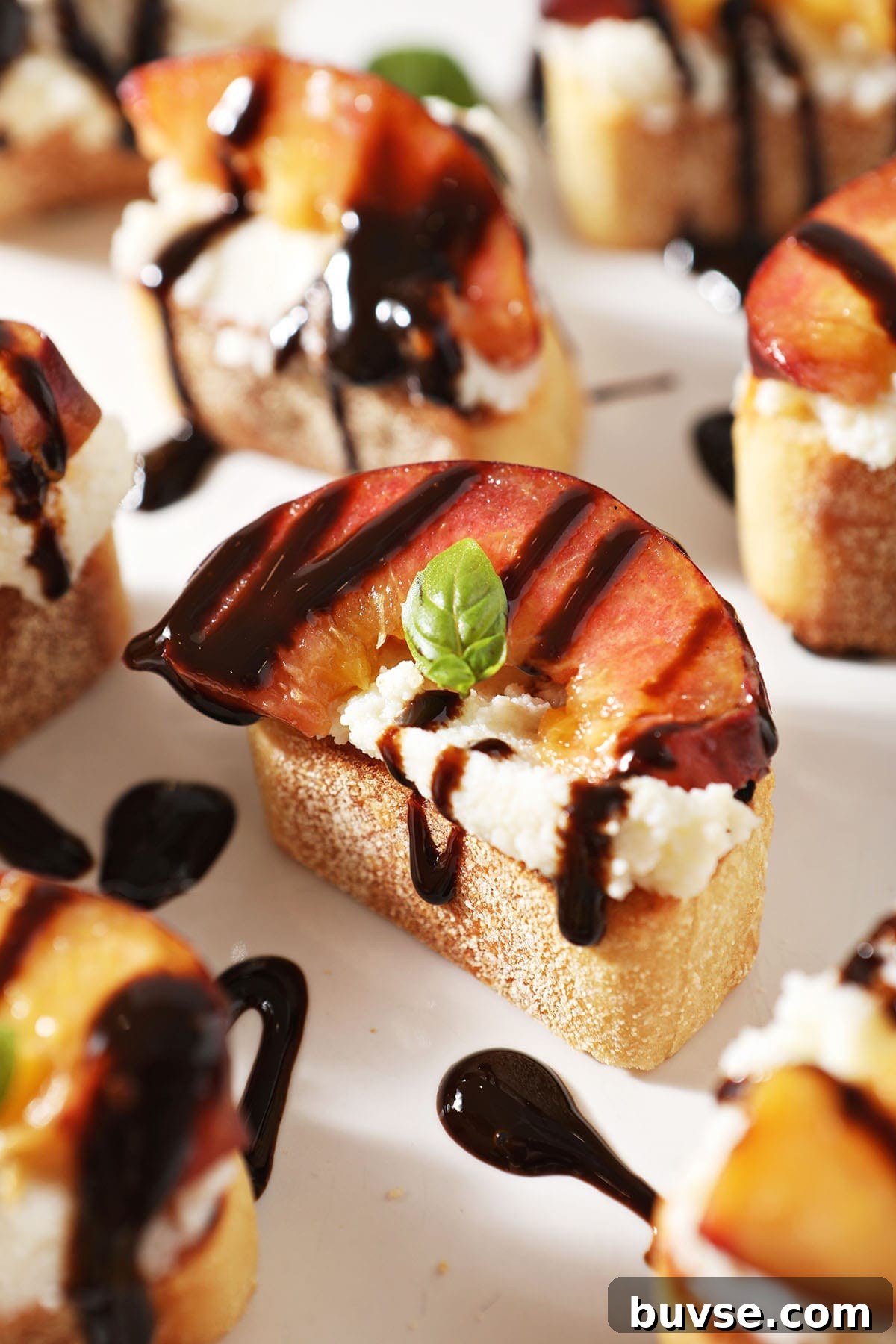 Summer Ricotta Crostini with Grilled Peaches 2 Close up of a Ricotta Crostini with a Grilled Peach