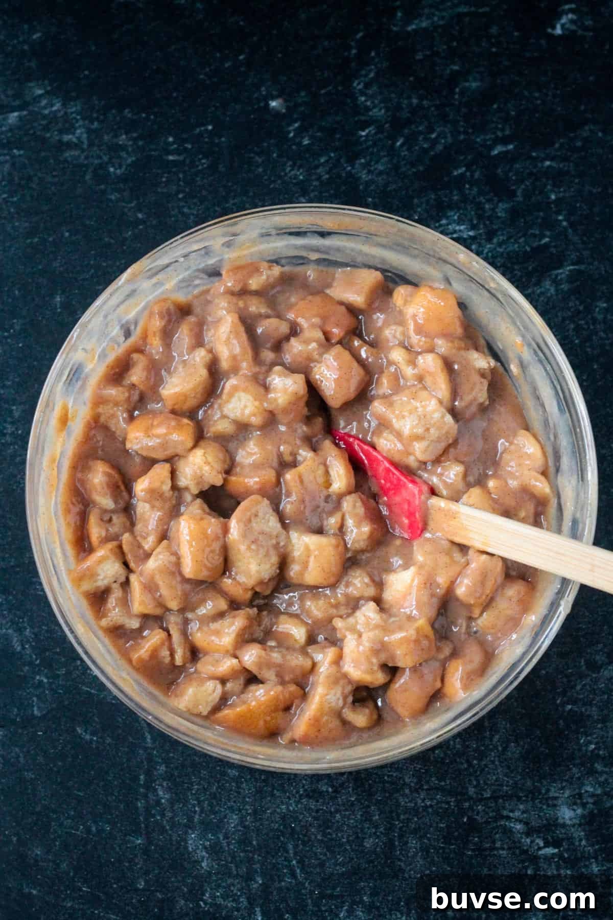 Creamy Vegan Bread Pudding Recipe with Cinnamon 11 Bread cubes mixed with the thick custard in a bowl.