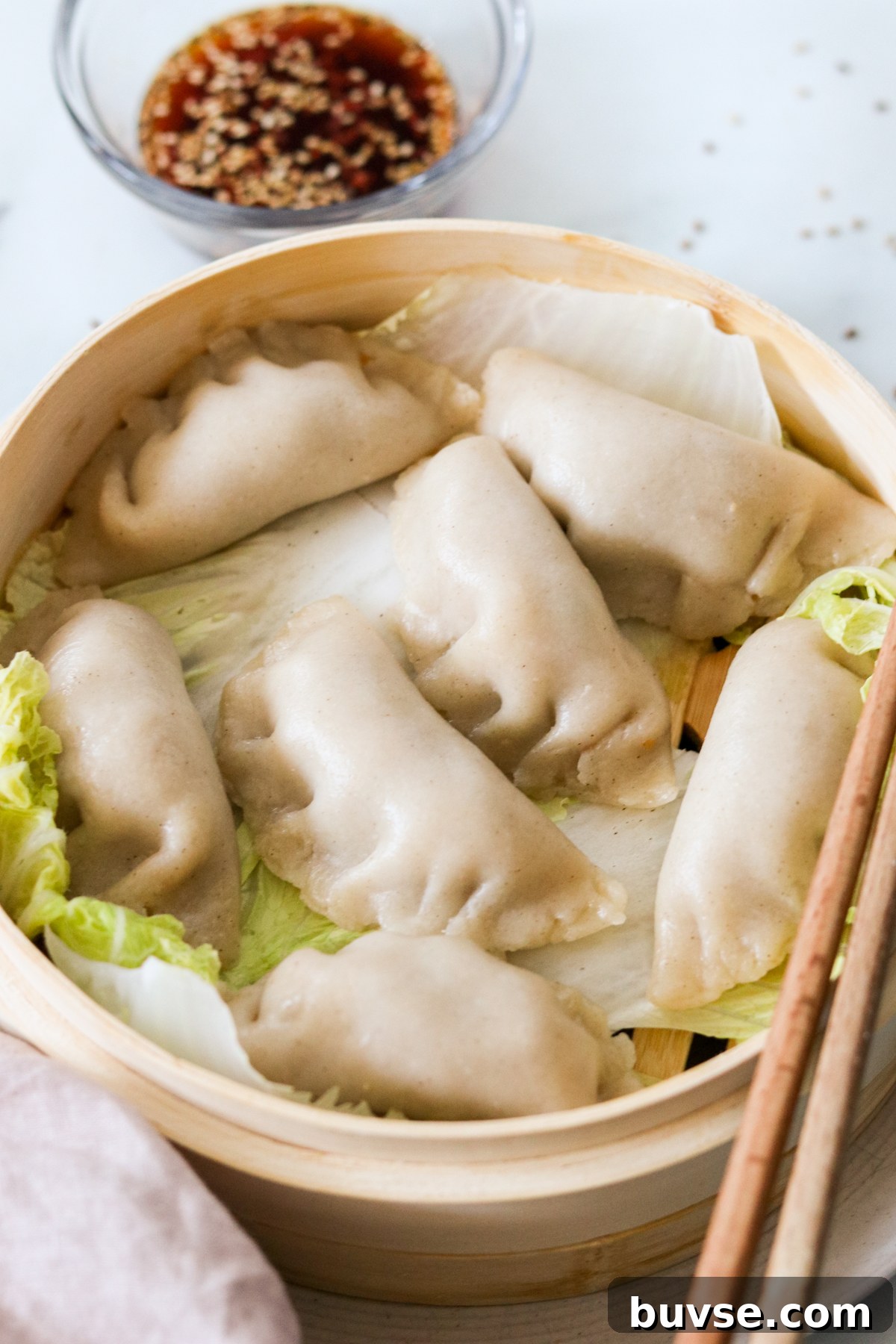 gluten free korean dumplings (mandu) cooked in a steamer basket