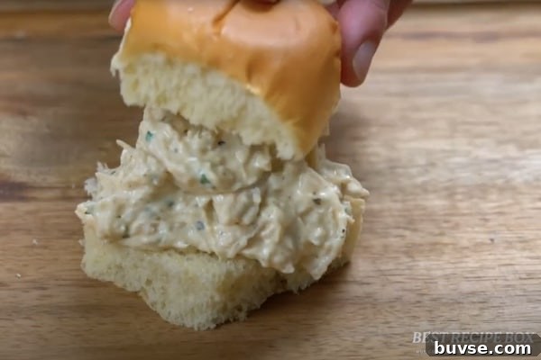 Placing the creamy garlic chicken in a slider