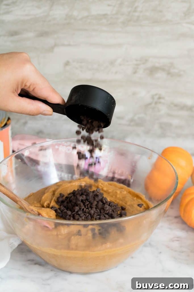 Mini chocolate chips going into the batter.