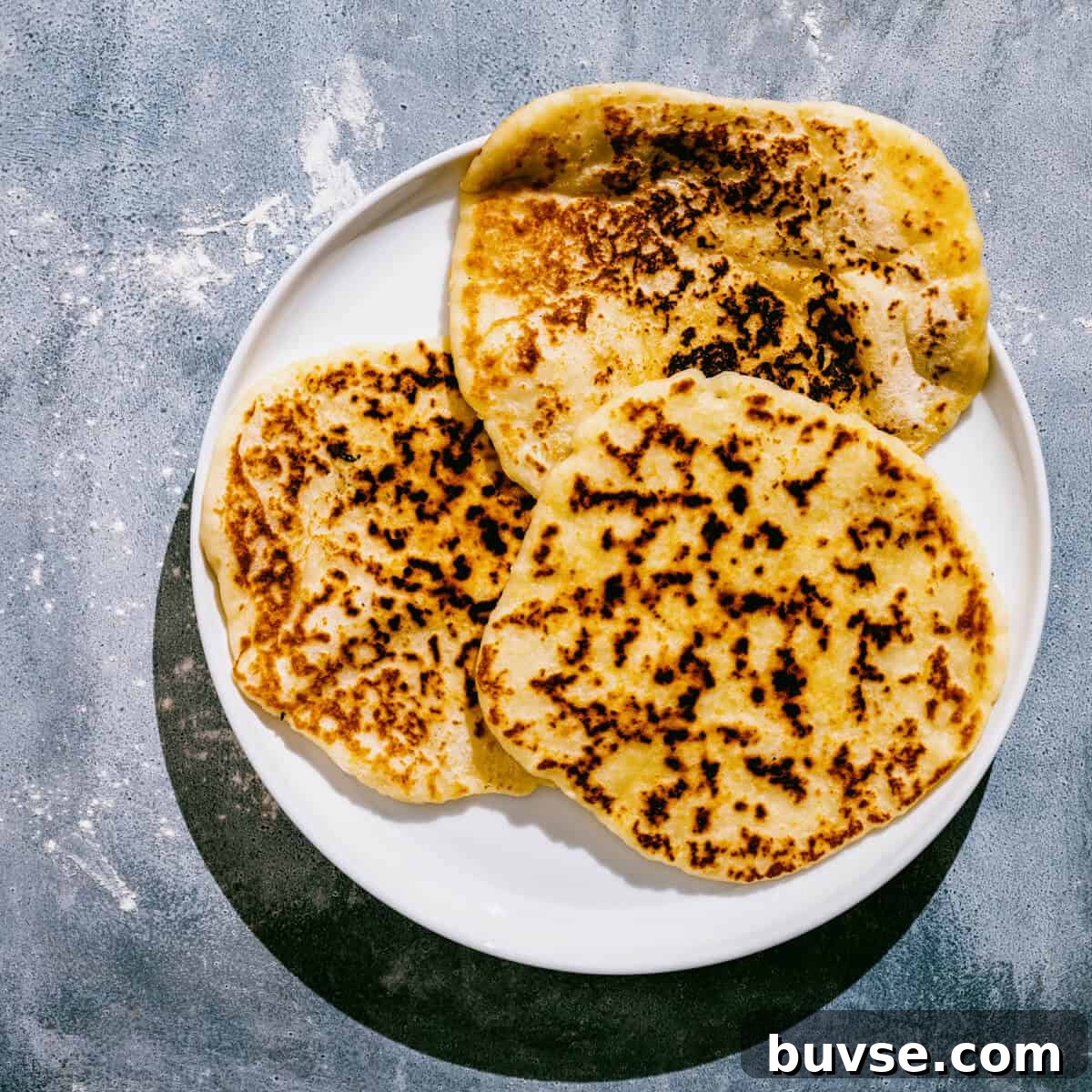 a whiter plate with 3 Greek yogurt flatbreads.