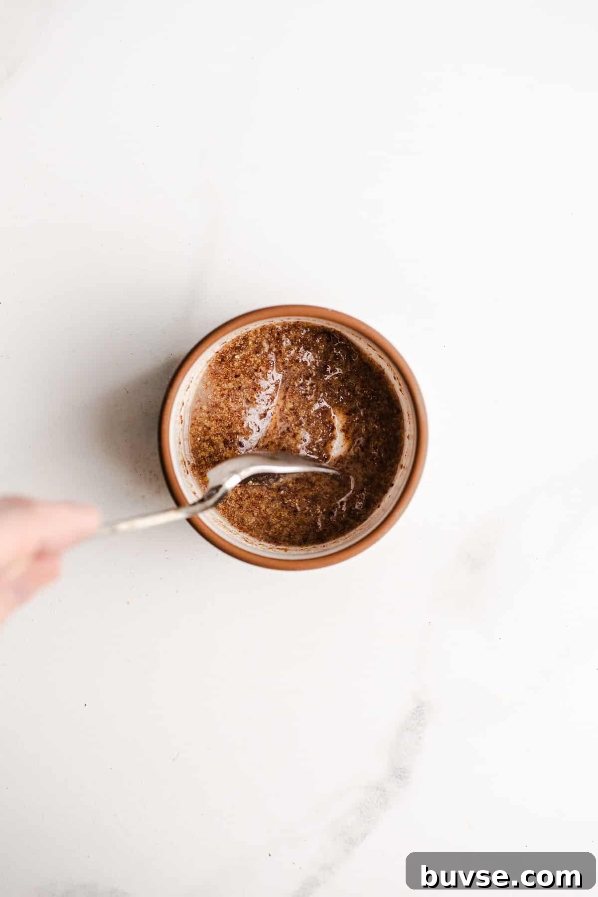 Ground flaxseed and water combined in a bowl.