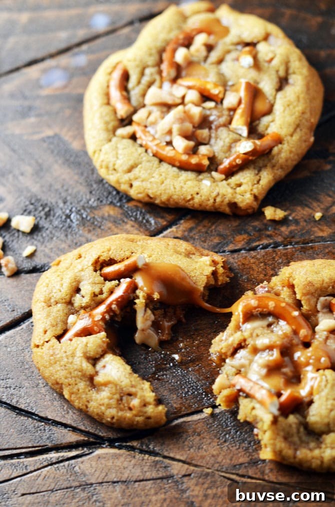 Salted Caramel Crunch Cookies. These brown butter based cookies are loaded up with caramel, toffee pieces, and salty pretzels to make an irresistible cookie that's perfect for the holidays! | hostthetoast.com