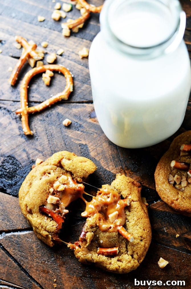 Salted Caramel Crunch Cookies. These brown butter based cookies are loaded up with caramel, toffee pieces, and salty pretzels to make an irresistible cookie that's perfect for the holidays! | hostthetoast.com