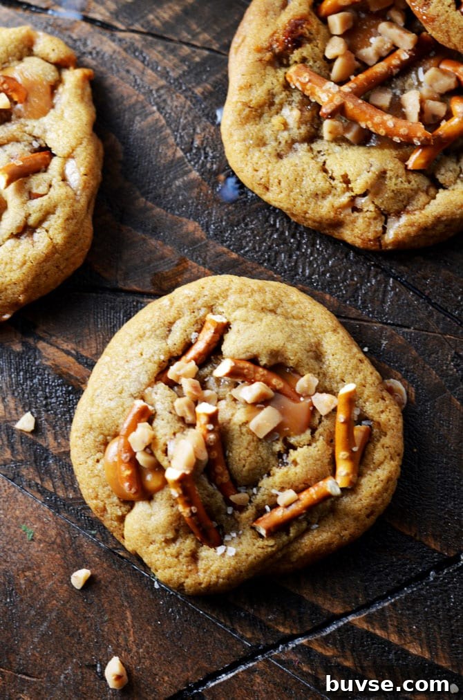 Salted Caramel Crunch Cookies. These brown butter based cookies are loaded up with caramel, toffee pieces, and salty pretzels to make an irresistible cookie that's perfect for the holidays! | hostthetoast.com