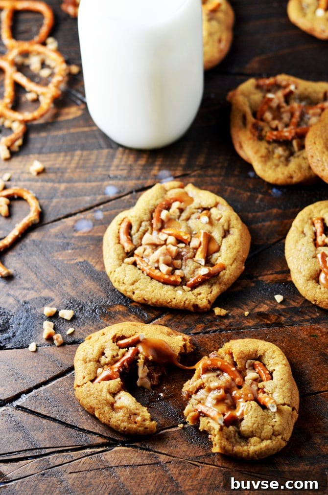 Salted Caramel Crunch Cookies. These brown butter based cookies are loaded up with caramel, toffee pieces, and salty pretzels to make an irresistible cookie that's perfect for the holidays! | hostthetoast.com