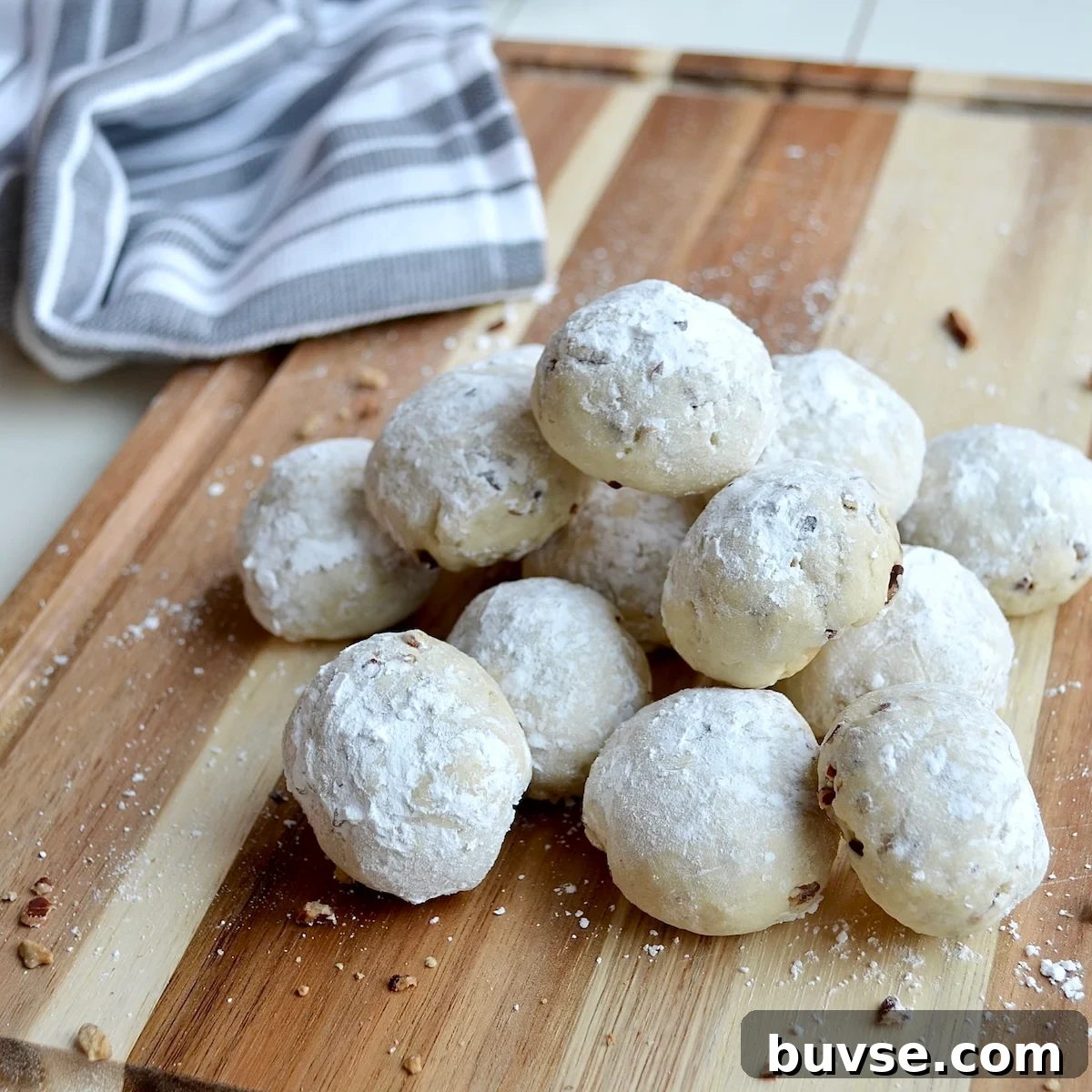 Snowball cookies on a cutting board