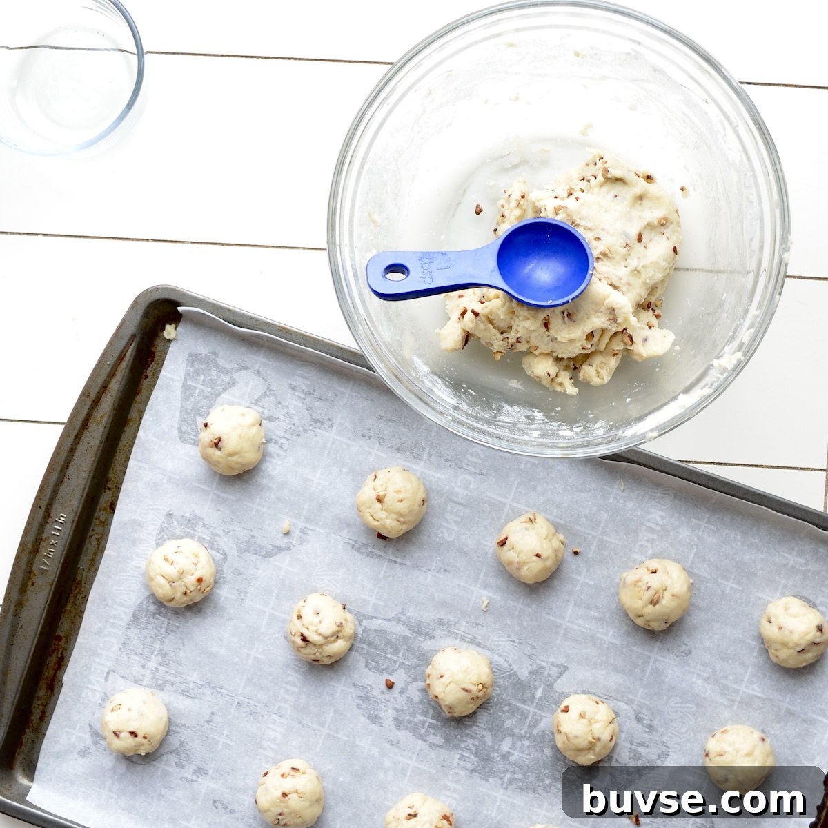 Cookie dough balls on a baking sheet