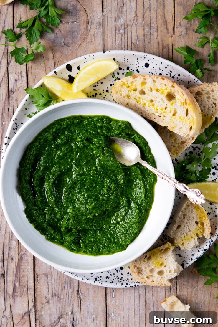 Parsley Pesto Recipe: Quick Homemade Pesto 2 Parsley pesto in a white bowl with a spoon