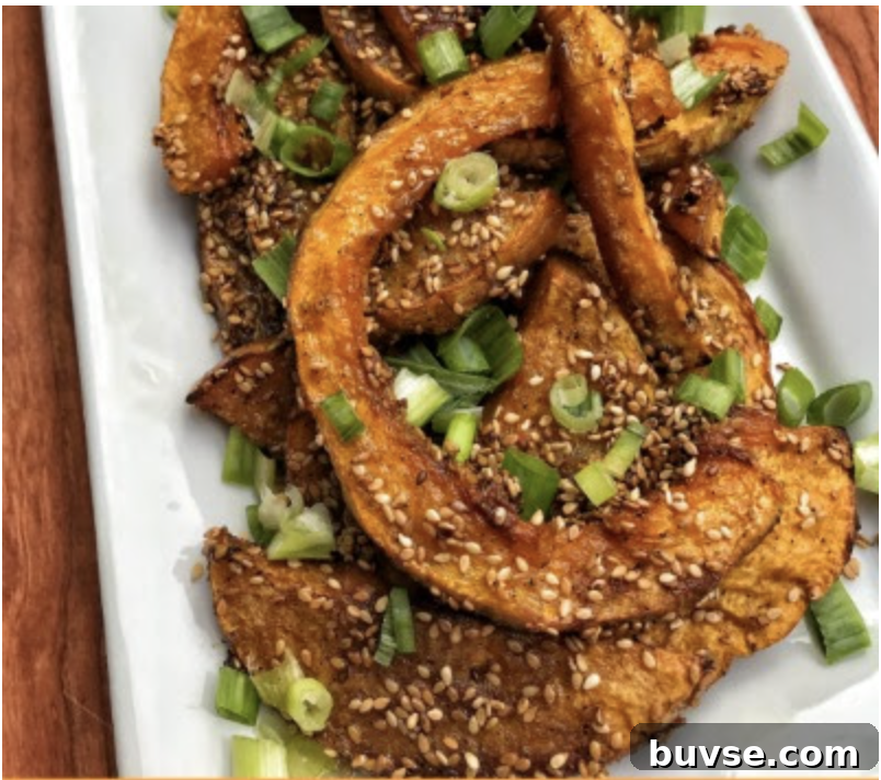 Candied butternut squash slices with sesame seeds and green onions.