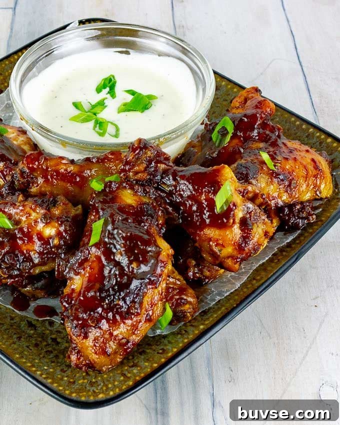 Baked Chipotle Barbecue Wings on square plate with ranch
